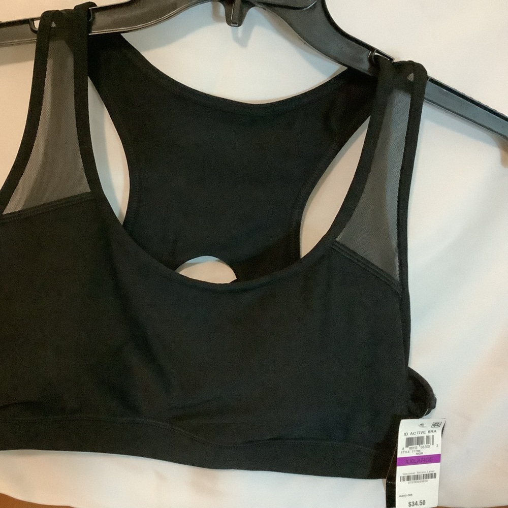 Black Racerback Sports Bra mid impact by Ideology. New with tags.